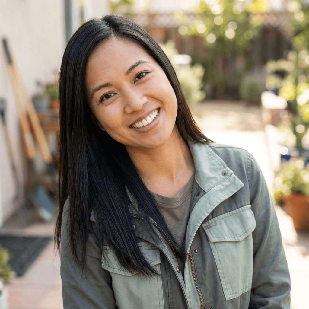 Amanda Reyes smiling in front of a Charlotte street scene